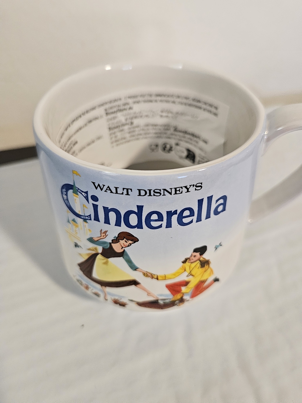 white ceramic mug featuring a vintage-style graphic of Prince Charming